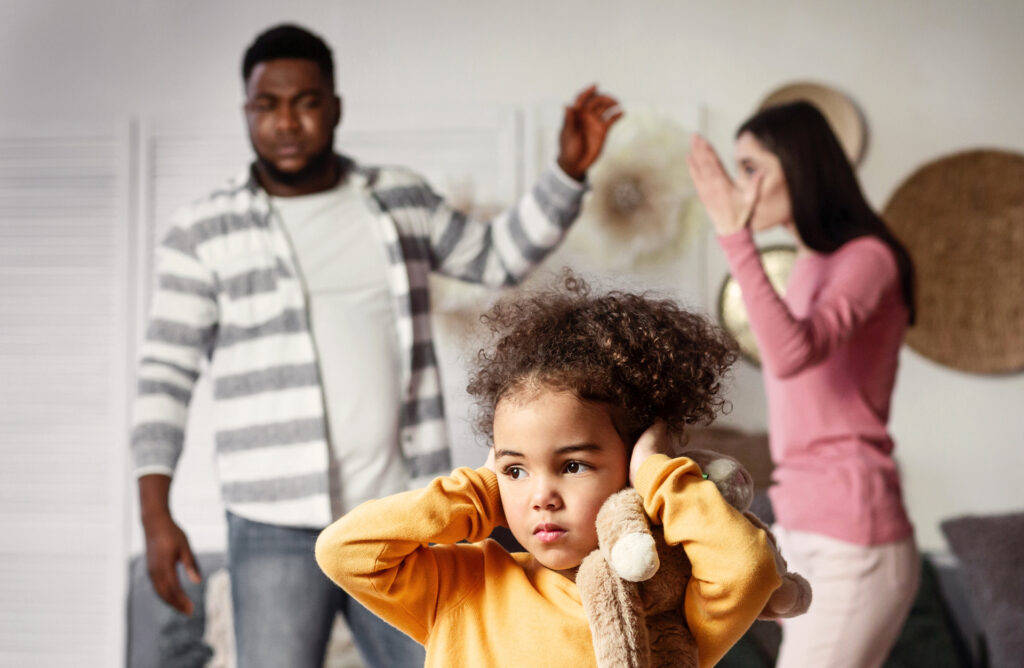 International family breaks up, child covers ears
